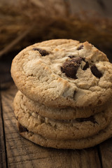 Chocolate chip cookies on old wooden table
