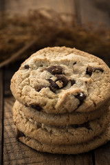 Chocolate chip cookies on old wooden table

