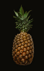 Pineapple isolated on black background. Ripe and juice pineapple
