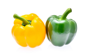 Yellow and green peppers isolated on white background