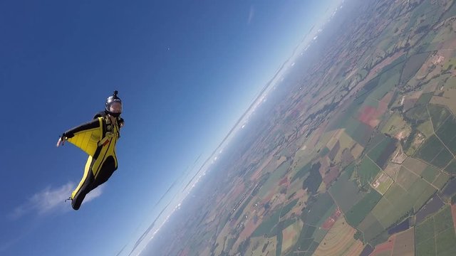 Skydiving wing suit woman acrobatic