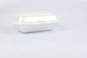 unhealthy polystyrene lunch boxes with take away meal isolated on white background.