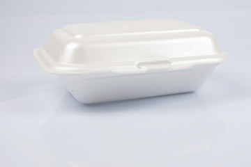 unhealthy polystyrene lunch boxes with take away meal isolated on white background.