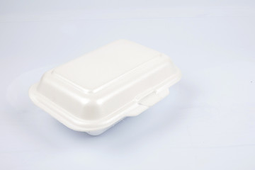 unhealthy polystyrene lunch boxes with take away meal isolated on white background.