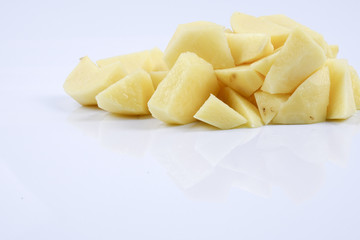 Fresh raw potato on white background.