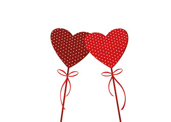 Two red hearts on a stick with bow and ribbon. Valentine's Day.