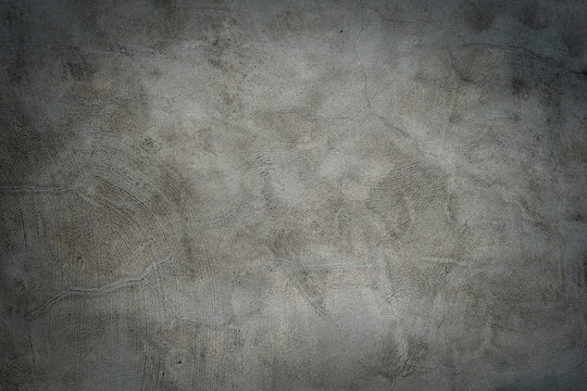 Grunge concrete cement wall with cracks.