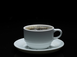 hot coffee with smoke on black background