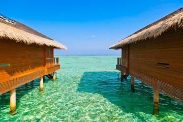 Bungalows on tropical Maldives island