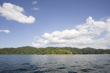 View of man-made lake of Royal Belum with nice green scenery and stumped wood.