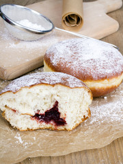 bitten donut on a wooden table