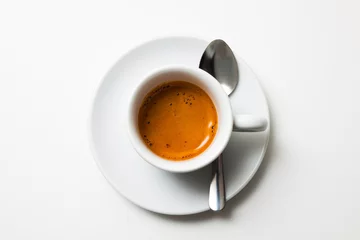 Foto op Plexiglas top view a cup of fresh espresso coffee, close-up © avirid
