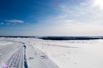 Beautiful and bright Canadian winter landscape during a great sunny day with some clouds. Quebec, Canada.