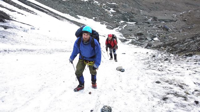 Climbers go up  to the mountain pass. 4K
