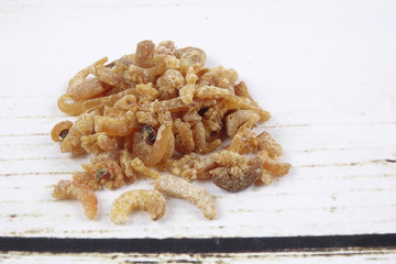 Dried shrimp isolated on wooden background