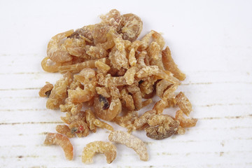 Dried shrimp isolated on wooden background