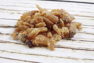 Dried shrimp isolated on wooden background