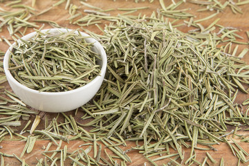 Dried rosemary leaves in the bowl (Rosmarinus officinalis)
