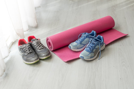 Dirty Sport Shoes On  Floor With Yoga Mat At Home. Lifestyle Con