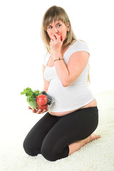 pregnant woman eating vegetables