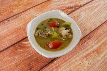 Chicken soup on wooden table. Top View.
