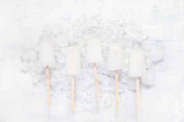 White lollies and ice cubes on the table