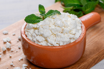 Cottage cheese in a clay pot
