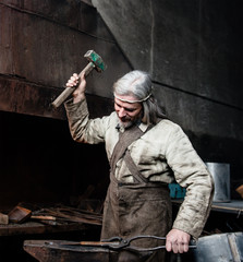Fototapeta premium Blacksmith working in the smithy