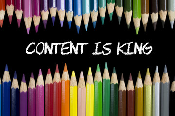 Content is King between colorful pencils on black background
