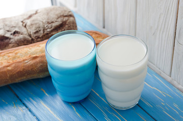 Two glasses of milk with bread