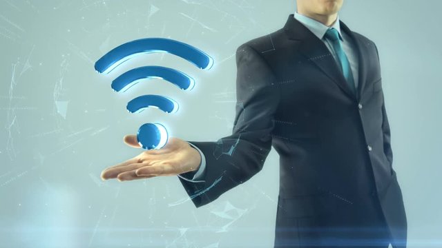 Business man has on hand wifi network symbol
