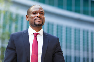 Portrait of a businessman in front of his office