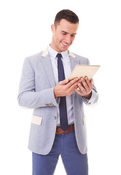 Businessman using tablet pc. Isolated over a white background