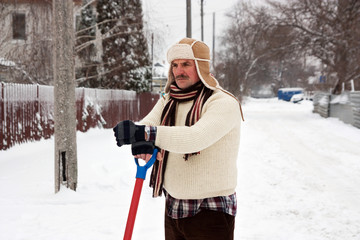 angry man clears snow