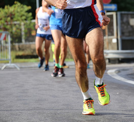 athlete muscular leg during the running race