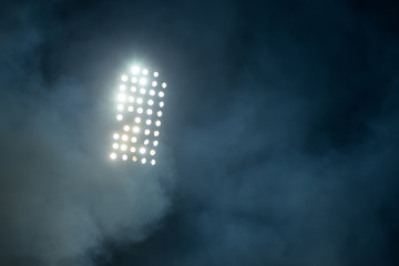 stadium lights and smoke