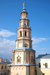 The bell tower of the Peter and Paul Cathedral on blue sky background close-up. Kazan, Russia