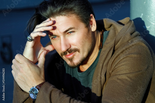 Handsome Trendy Guy With Blue Eyes Deep In Thought Outdoors Stock