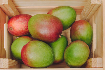 Close-up of mango fruit in wooden box