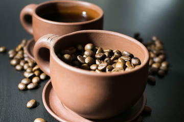 cups with coffee and coffe beans