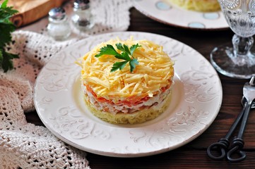Salad of boiled potatoes, carrots, eggs, hard cheese, smoked chicken breast and white onion with mayonnaise. Russian traditional festive salad.