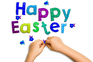 children's hands and words fashioned from clay Happy Easter on a white background
