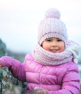 Little Girl In Winter Season With Red Cheeks