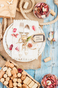 Tableware and silverware with dry flowers and different decorations
