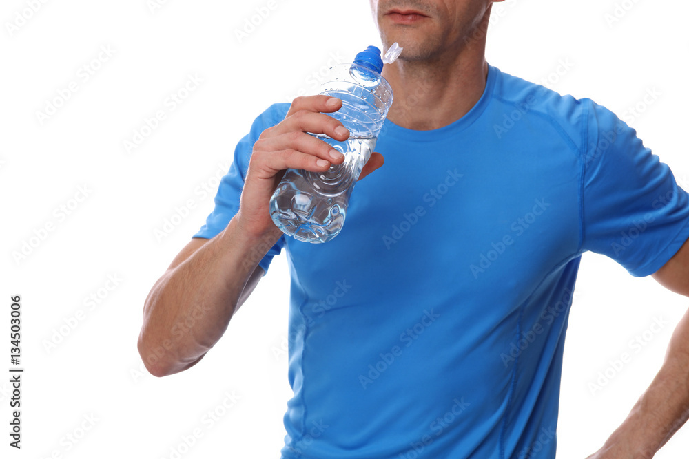 Wall mural sport fitness man holding bottle of water close up on white background