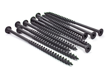 Black tempered screws for fastening wood on a white background