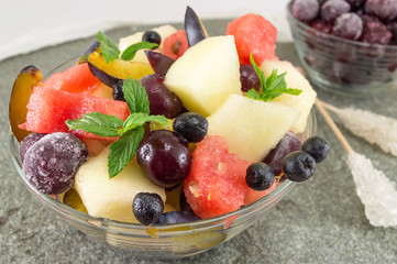 Obraz na płótnie Canvas fruit salad in a glass bowl