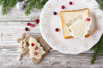 Fun food for kids and adults to toast  the festive lunch on Christmas  New Year of white  bread in the shape   trees. View from above. Selective focus