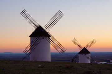  windmills at field in sunrise