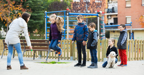 Children playing skipping rope
